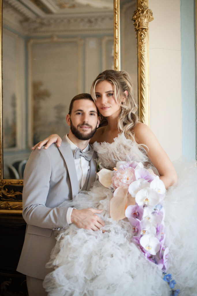 Bride and Groom in front of mirror first look wedding - modern princess fairytale wedding Germany - historic venue castle-style - Alleesaal Bad Schwalbach Germany - Exclusive Wedding Planning and Design - MichelleMarie Weddings - Pia Schmeling - Frankfurt-Rhein-Main-Hesse-Germany - Weddingdress Millia London - Bridal Bouquet flowing orchids Blumen Koser